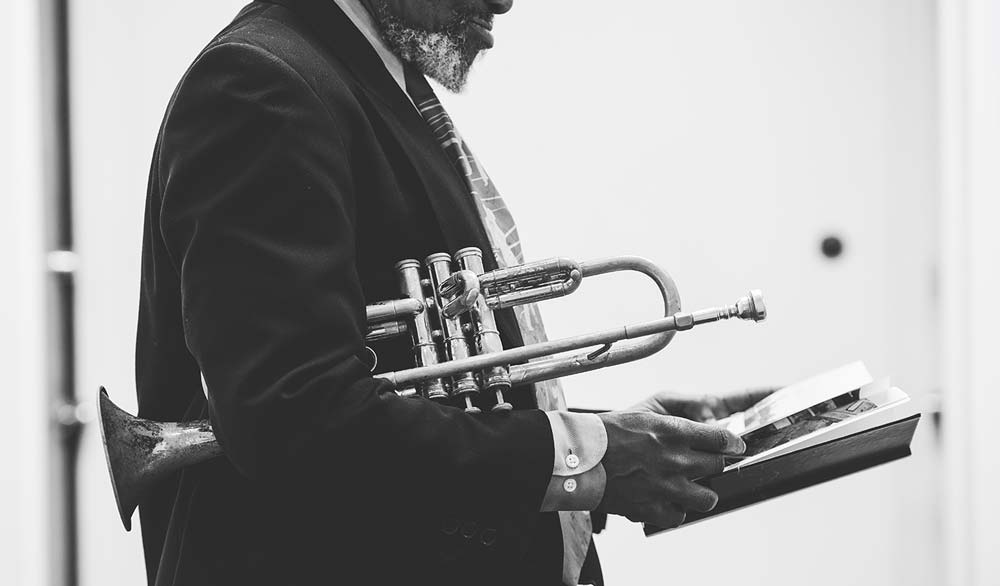 A musician looks through a memory book