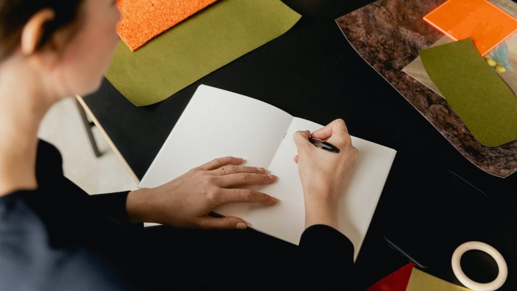 Person working on a book dummy